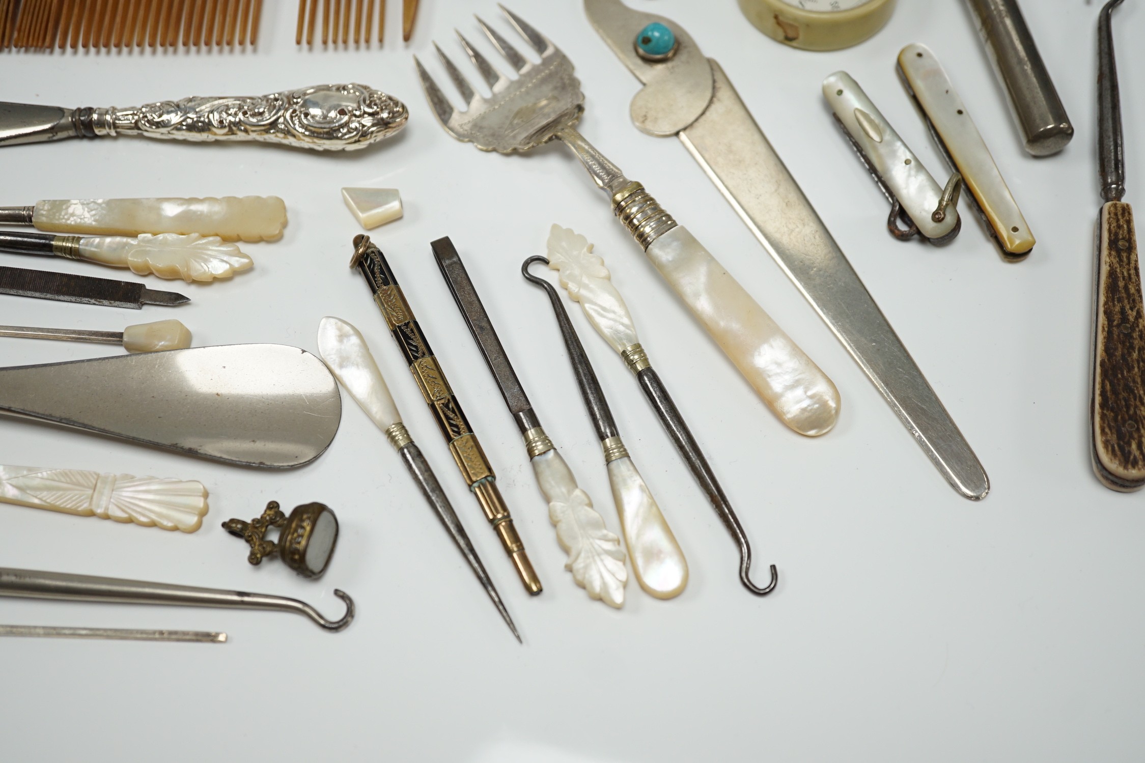 A group of assorted small silver and white metal items, including a small late Victorian clover shaped nut dish, napkin rings, pill box, etc and other items including two gilt metal mounted chalcedony fob seals.